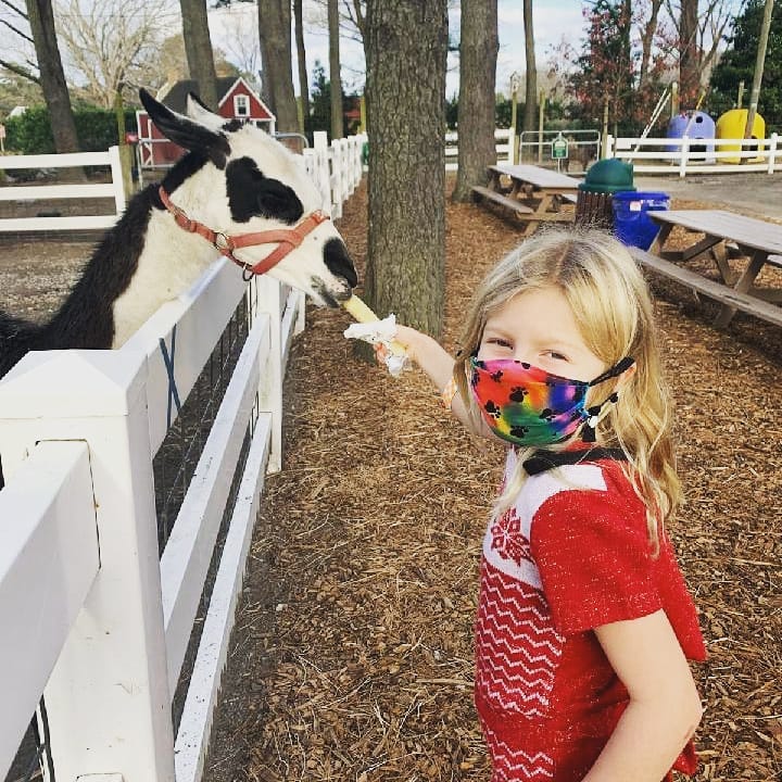 Hailey G. of Virginia Beach, Va, sharing her happy with the animals at Hunt Club Farm!
